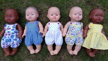 Minikane dolls dressed for summer in matching outfits