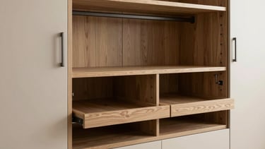 A detailed shot of a custom modular wardrobe and dressing area in a modern Indian home, focusing on the fine craftsmanship and durable materials used.