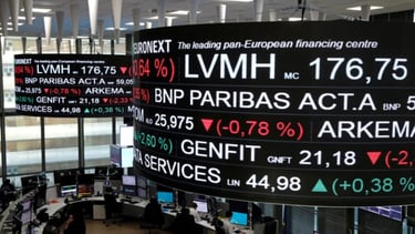 a large screen displaying a large display of various currency