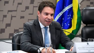 a man in a suit and tie is sitting at a table