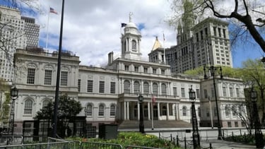 a large building with a clock tower in the middle of it