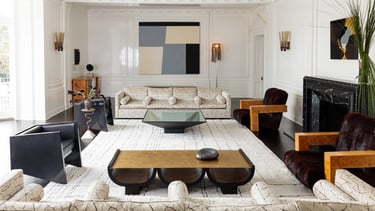 Kelly Wearstler design- living room with a couch and a fireplace.