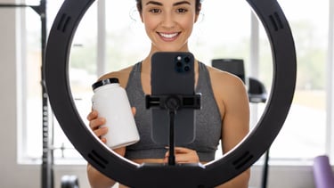 a woman holding a cell phone and taking a selfie