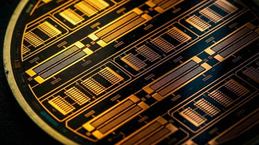 Macro photography of a raw custom silicon microchip wafer circular plate.