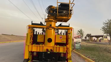 a yellow crane truck with a crane on it