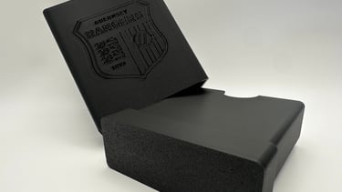 Custom 3D printed black Guernsey Rangers logo storage box.