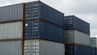 Industrial editorial photography of shipping containers stacked neatly at ICD Tuglakabad under overcast sky, cool steel tones, sharp focus, 35mm