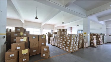 Goods are neatly arranged on the shelves in the factory warehouse, with clear labels