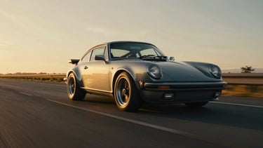 Wide panoramic golden-hour rolling shot of a classic sports car on an open road, dramatic low-angle light, deep metallic reflections, 35mm anamorphic lens.
