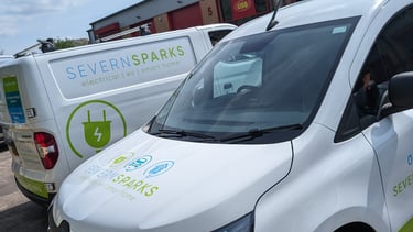 a van parked in front of a building