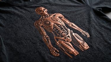 Extreme macro shot of copper ink lines on a dark cotton t-shirt, revealing the texture of the fabric and the precision of the printed steampunk anatomical illustration, dramatic chiaroscuro lighting.