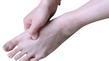 Acupressure on acupuncture point Liver 3.