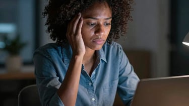 A mentor guiding a young woman through career planning with charts and notes.