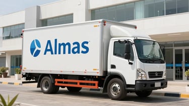 Wide panoramic view of an Almas temperature-controlled delivery truck parked outside a bright, modern clinic in Mogadishu, clean daylight, professional clinical setting.