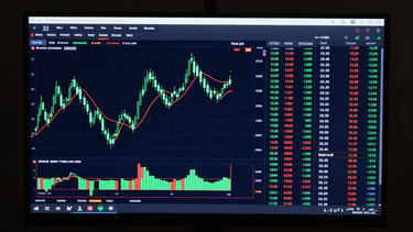 Dark trading dashboard UI on a wide monitor, candlestick chart in neon green on deep navy background, real-time price columns with Indian rupee values, market depth panel visible on right, dramatic under-screen glow, no text overlays