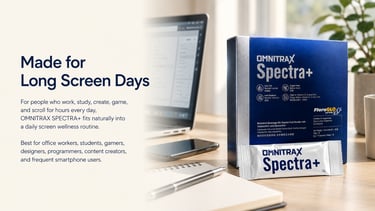 Omnitrax Spectra+ eye health supplement box on a desk next to a laptop for screen wellness.