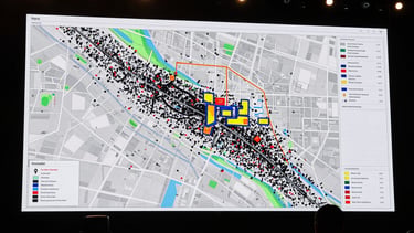High-contrast, utilitarian overhead shot of a technical venue map with overlaid heat-map data, showing crowd flow and strategic medical deployment points, clean sans-serif annotations, 35mm lens