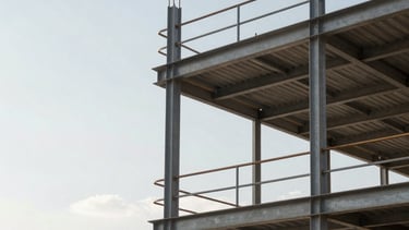 Professional architectural photography of a modern construction site in Guadalajara, Mexico. The shot features a clean, structural steel assembly against a bright sky, symbolizing technical precision and safety. The composition is minimalist and technical, reflecting a corporate engineering firm's efficiency.