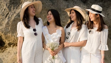 Bride and friends celebrating bachelorette party at Melasti Beach Bali during sunset