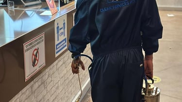 a man in a uniform is standing in front of a counter