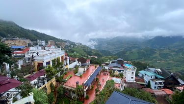 a view of a city with a mountain in the background
