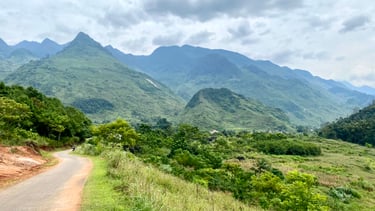 a road with a mountain view of a road
