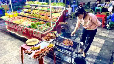 a street vendor is cooking food on a grill