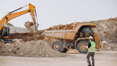 Heavy machinery trenching for underground utility installation in Saudi Arabia