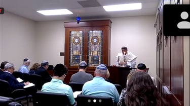 Rabbi Rudnick leading services
