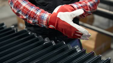 a person wearing gloves and gloves holding a glove