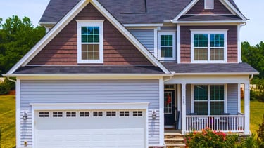 a house with a garage door and a garage door