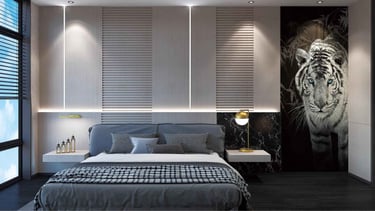 a bedroom with a bed and a painting on the wall