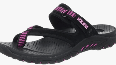 a woman's black and pink sandals with pink and white stripes