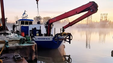 a crane crane is being lifted by a crane