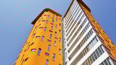 a tall building with a clock tower in the middle of it