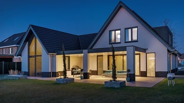 a house with a large backyard area and a patio area