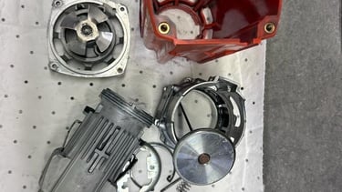 a red plastic container with a red handle and a red handle