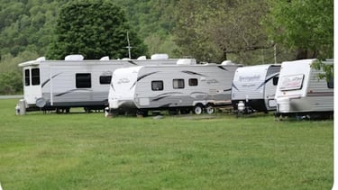 Mobile electrician servicing caravan electrical system at customer location