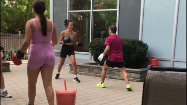 A group of people training Jeet Kune Do martial arts in a North York courtyard area.