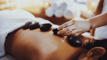 a woman getting a massage at a spa