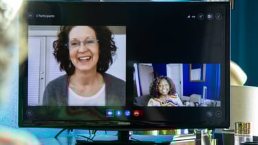 a woman is shown on an online coaching call on screenen
