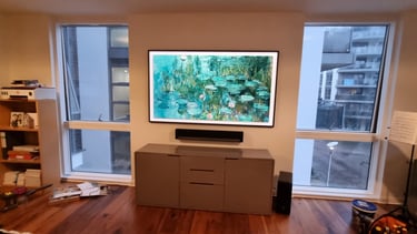 Bespoke AV installation featuring a flush-mounted Samsung Frame TV in a luxury London home