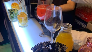 a bartender is pouring a drink at a bar