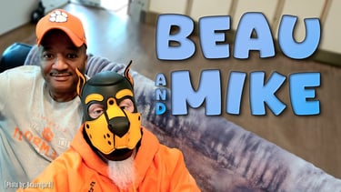 2 men - 1 in a cap, the other in a pup mask. BEAU & MIKE