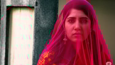 a woman in a red veiled