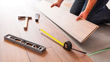 Laminate flooring installation custom transitions baseboards Lynnwood living area
