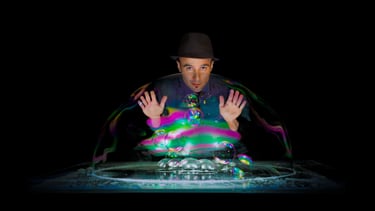 a man with a hat and a hat on a table