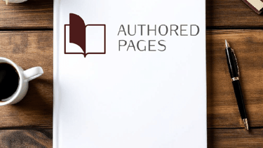 book cover that reads authored pages laying on a table.