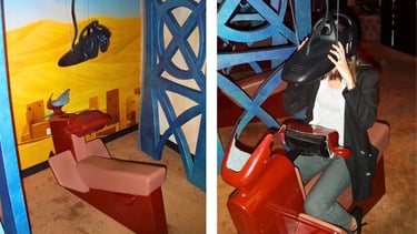 An Aladdin-themed virtual reality station at DisneyQuest featuring a red seat and a black VR headset.