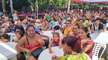 A large community gathering of families  at a Mother's Day Event organized by Roger Bardales